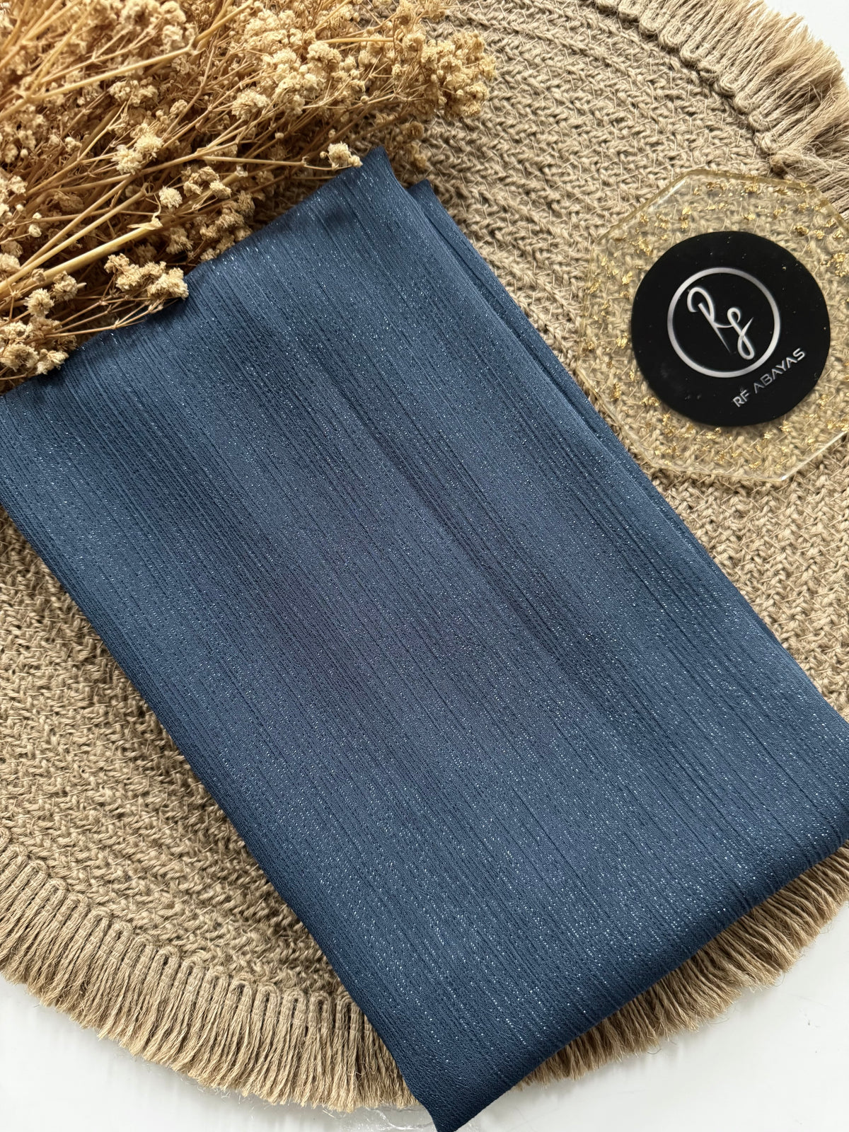 Shimmering metallic silk hijab in elegant design by RF Abayas, showcasing a luxurious satin finish and smooth drape.