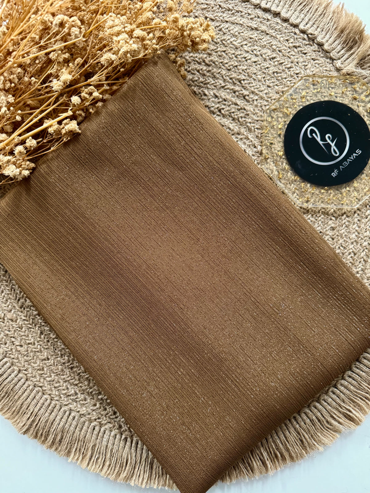 Elegant metallic silk shimmer hijab by RF Abayas, showcasing smooth fabric with a subtle shimmer in a stylish drape.