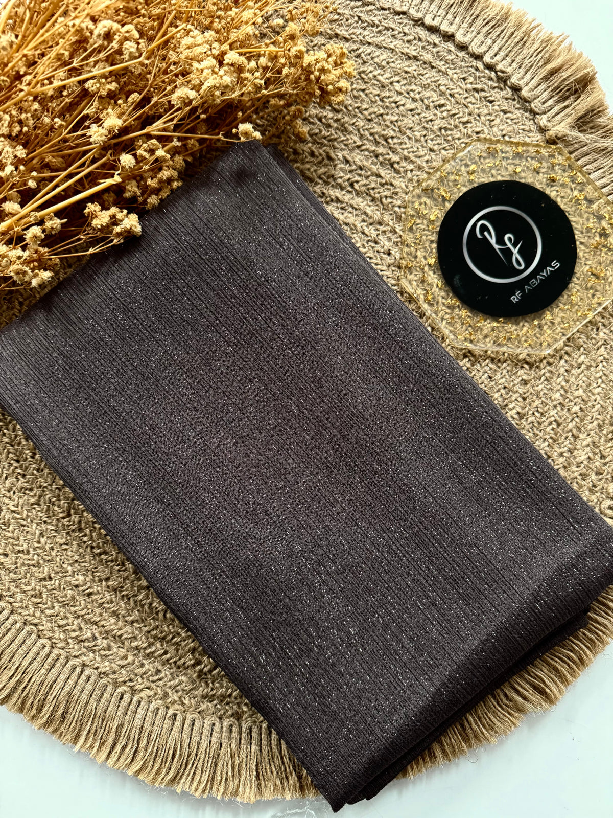 Elegant metallic silk shimmer hijab by RF Abayas, showcasing smooth, shiny fabric with a luxurious metallic finish.