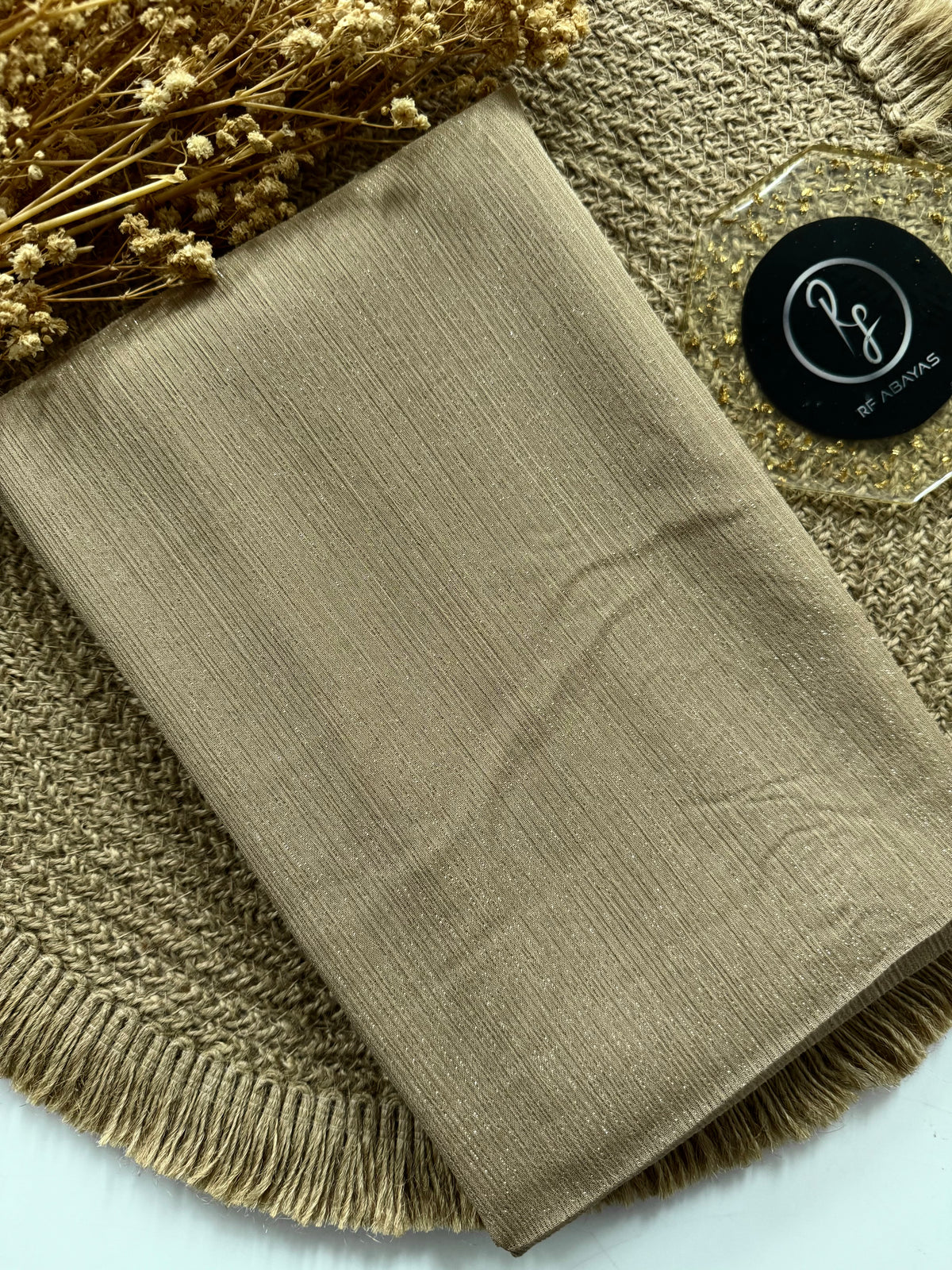 Elegant metallic silk shimmer hijab by RF Abayas, featuring a luxurious metallic finish and silky smooth texture.