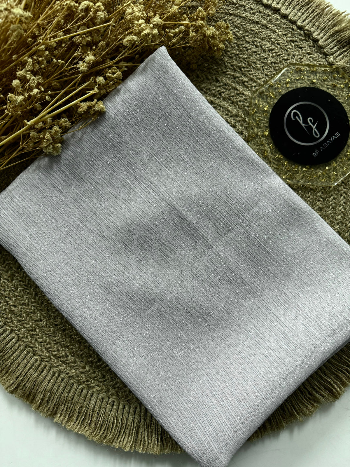 Elegant metallic silk shimmer hijab by RF Abayas, showcasing luxurious fabric with a shiny, silky finish and metallic sheen.