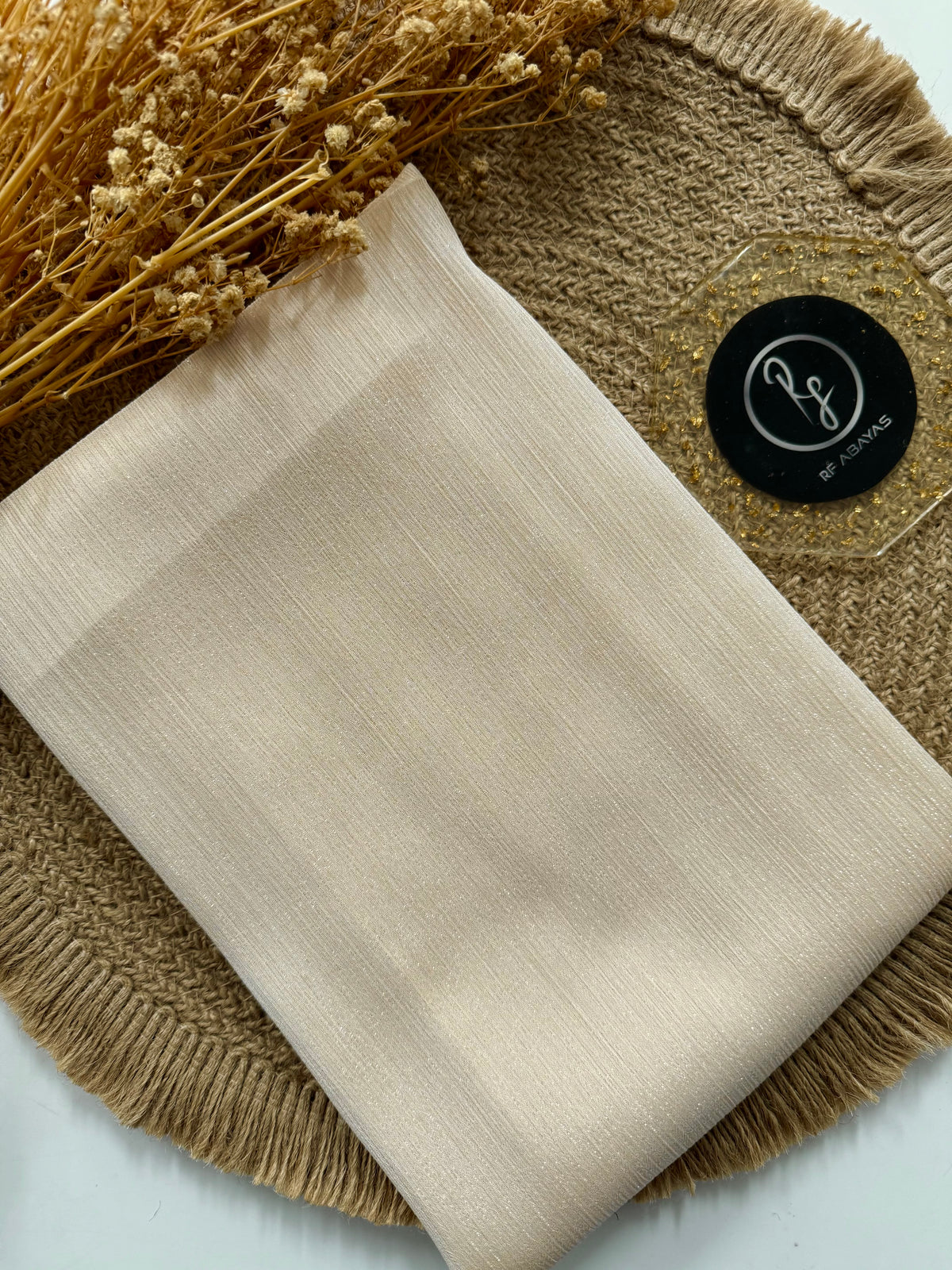 Elegant RF Abayas metallic silk shimmer hijab in shimmering gold with a smooth, silky texture and metallic finish.