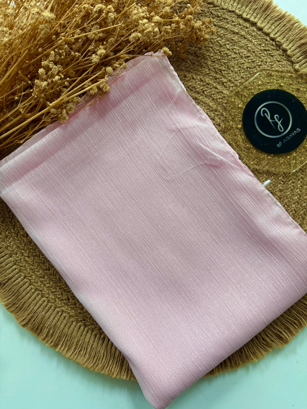 Elegant RF Abayas metallic silk shimmer hijab in soft, shimmering fabric with a smooth, luxurious finish.