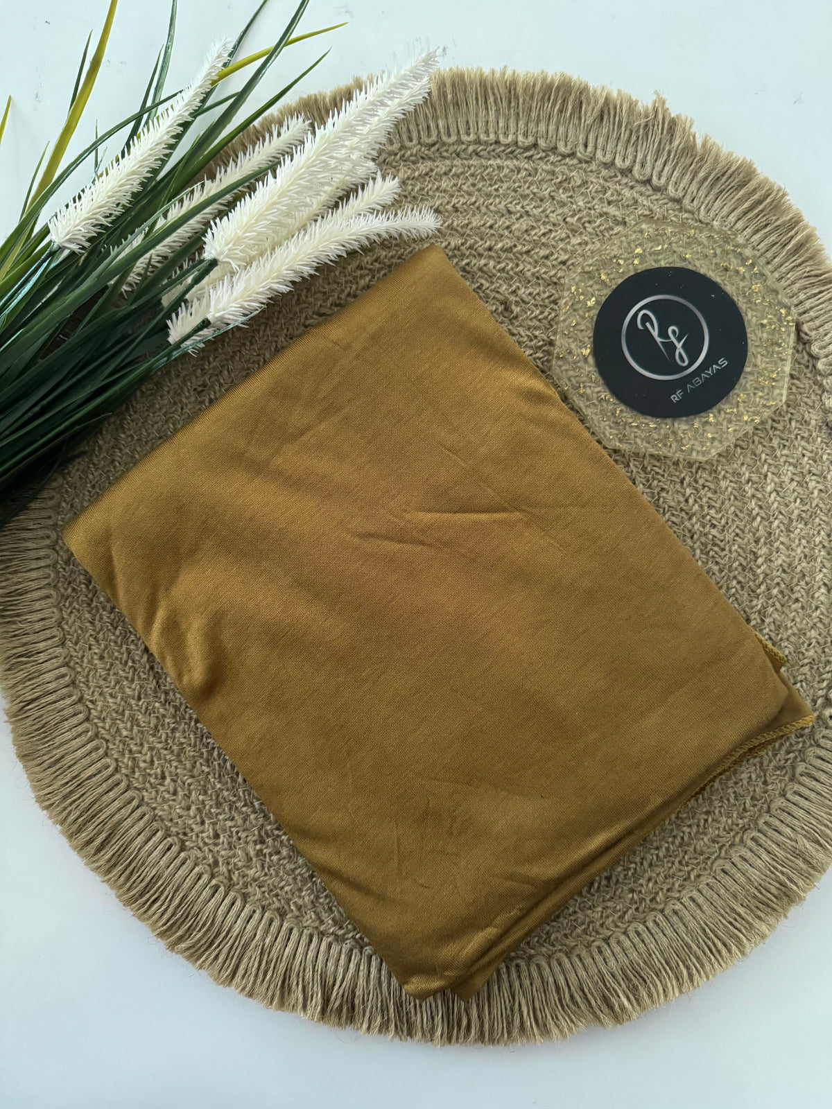 RF Abayas Bamboo Jersey Hijab in natural beige, lightweight and soft fabric, styled for modest fashion wear.