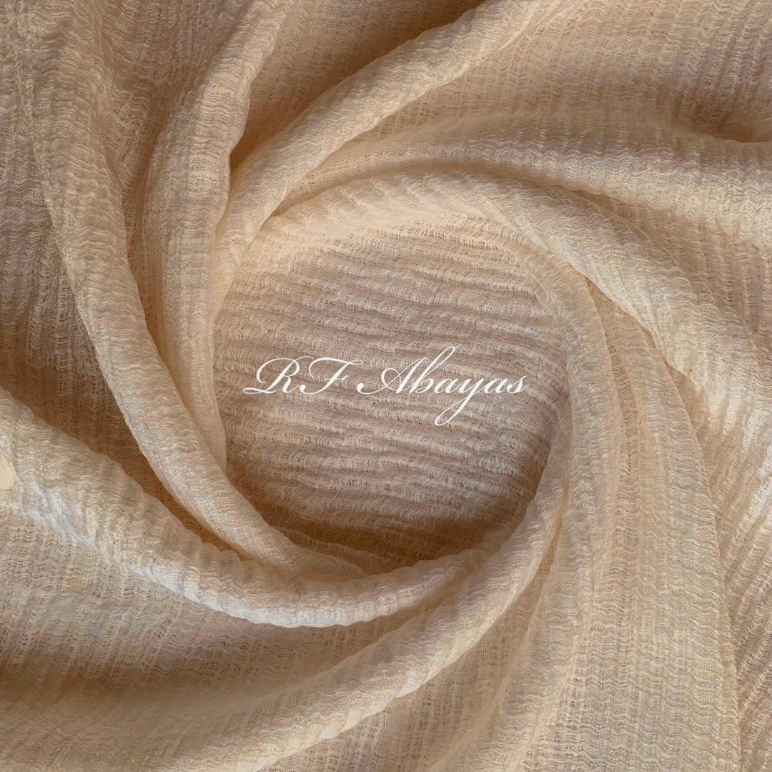 Heavy crinkled maroon cotton hijab by RF Abayas displayed flat, showing its textured, lightweight fabric and elegant drape.