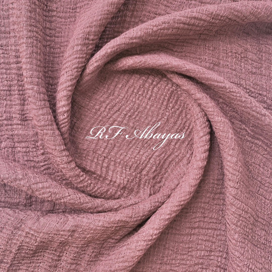 Heavy crinkled cotton hijab by RF Abayas, showcasing a soft, textured maroon fabric with elegant draping.