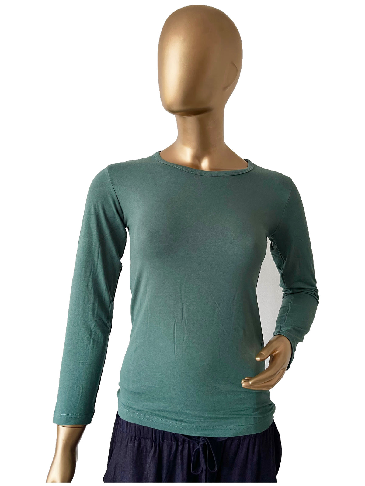 Black women's full sleeve innerwear in XL from RF Abayas, close-up of soft fabric and simple design for comfortable wear.
