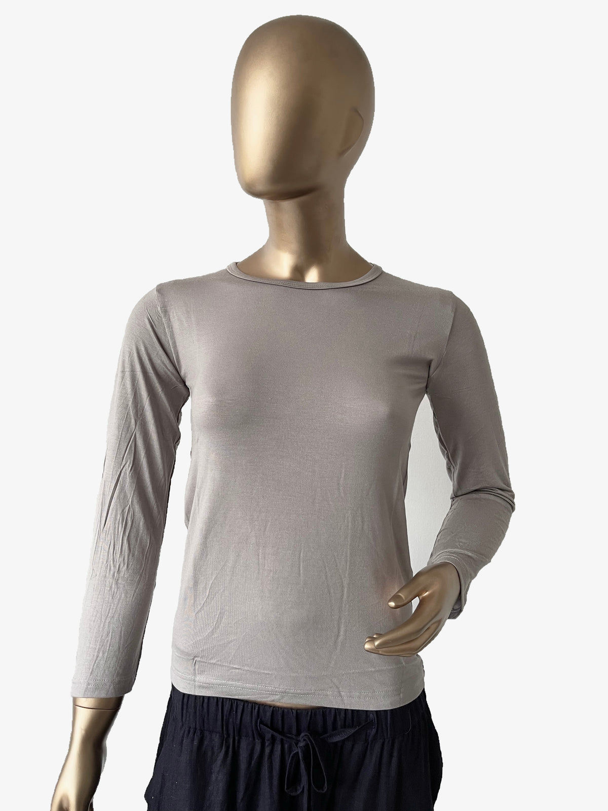Black women's full sleeve innerwear in XL size from RF Abayas, close-up view of the comfortable, smooth fabric.