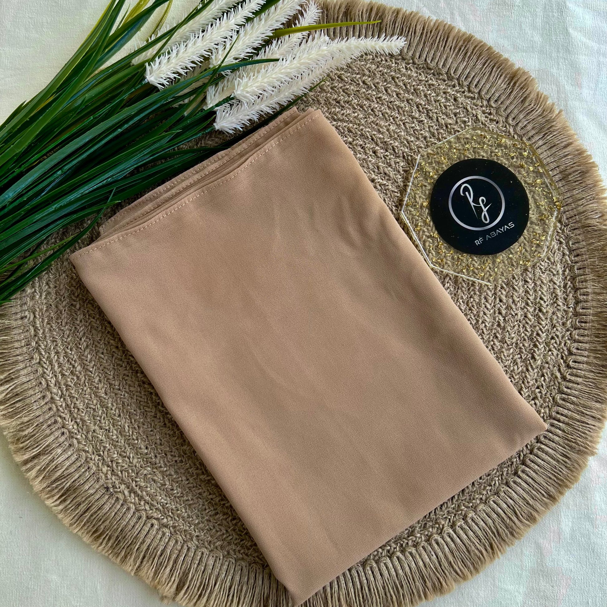 Elegant diamond georgette hijab in soft fabric, styled with delicate folds, designed by RF Abayas for modest fashion.