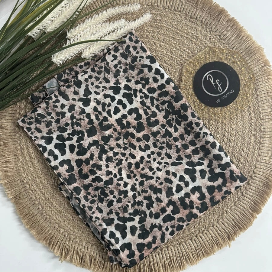 RF Abayas animal print chiffon hijab draped on a mannequin, showcasing stylish and lightweight hijab with bold animal patterns.