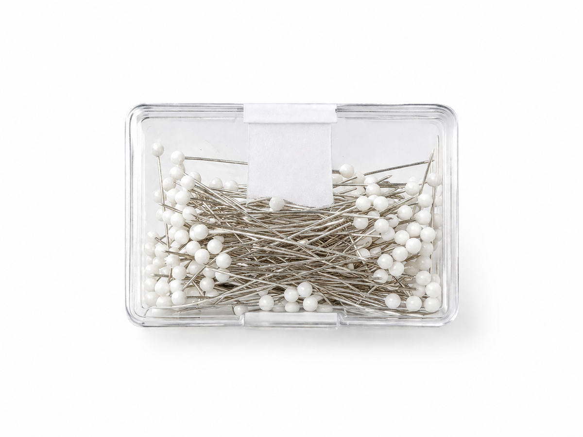 Small RF Abayas hijab pin box with multiple decorative hijab pins for headscarves and modest fashion accessories.