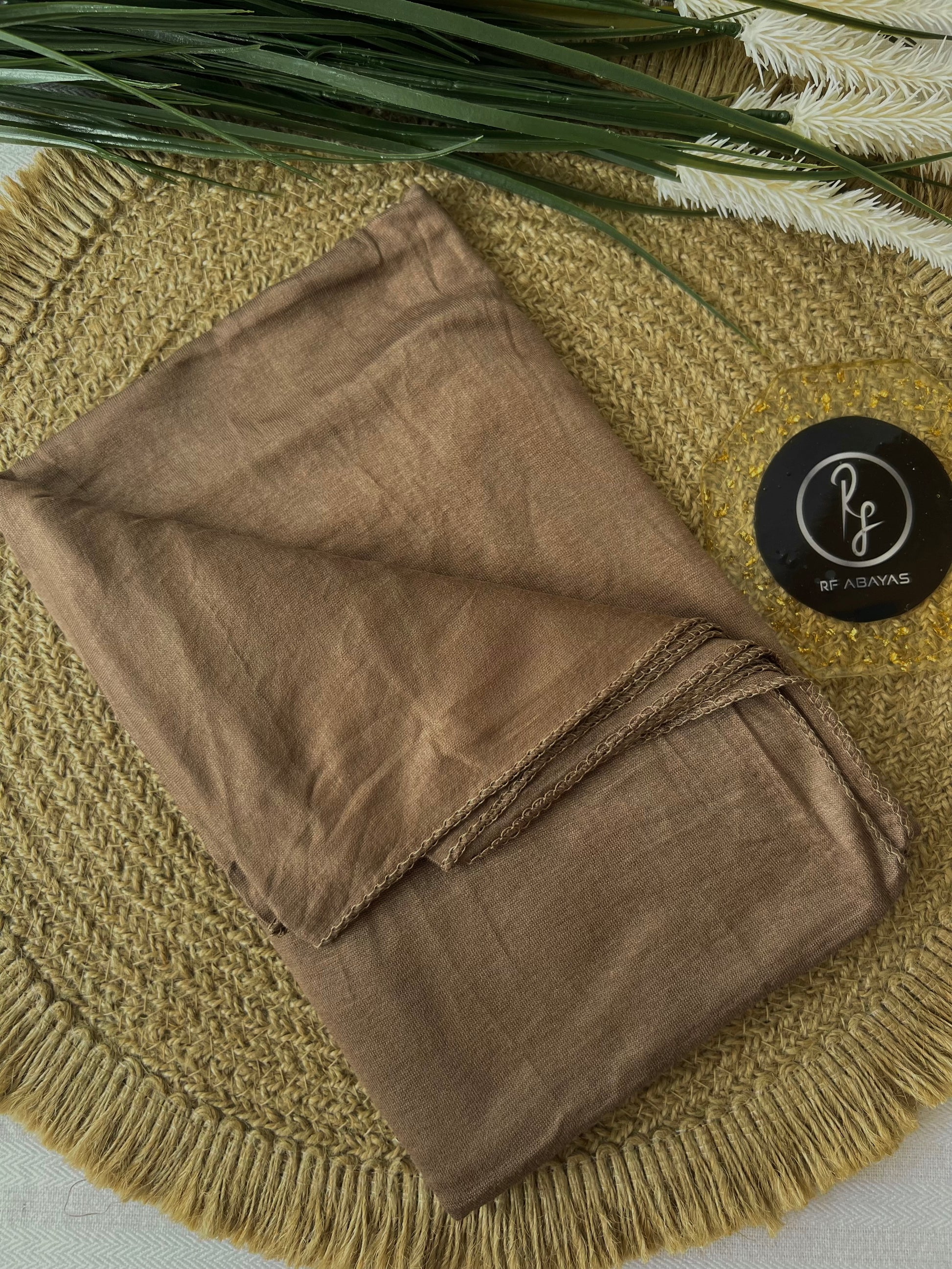 RF Abayas bamboo jersey hijab in natural beige, soft and lightweight fabric, draped neatly for everyday modest wear.