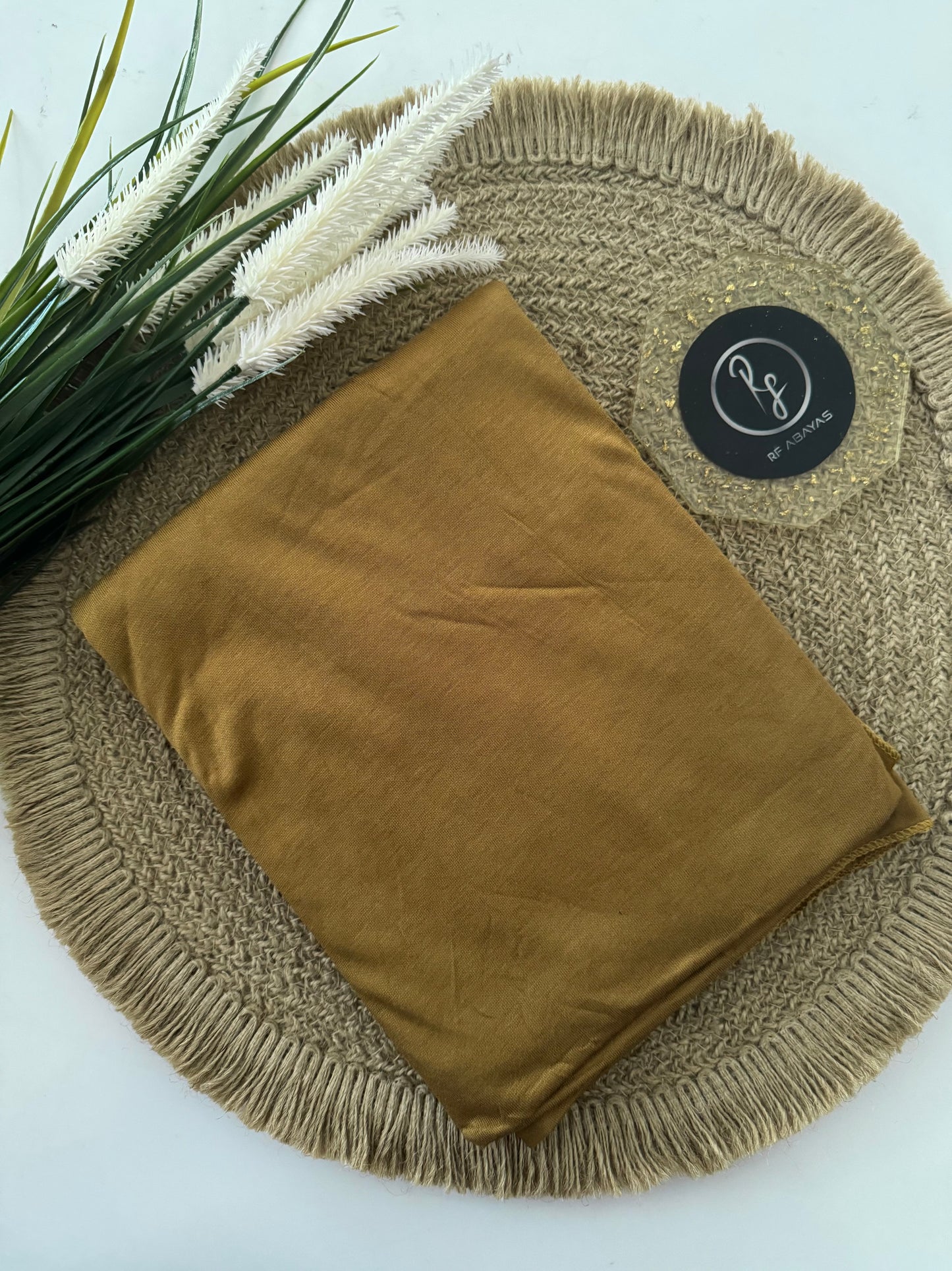 RF Abayas Bamboo Jersey Hijab in natural beige, lightweight and soft fabric, styled for modest fashion wear.