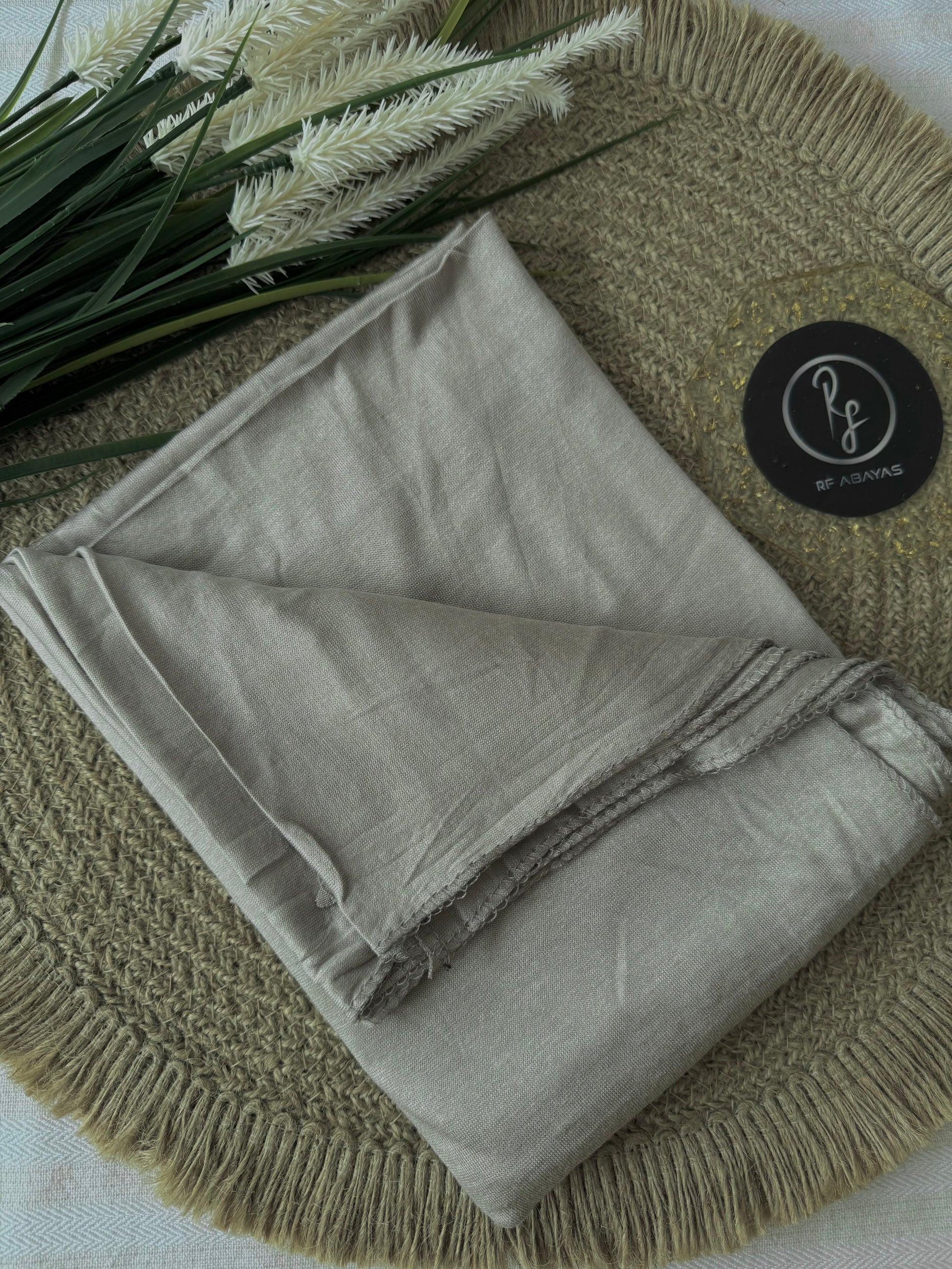 Ivory bamboo jersey hijab by RF Abayas, soft and lightweight fabric with a smooth, comfortable fit, shown draped naturally.