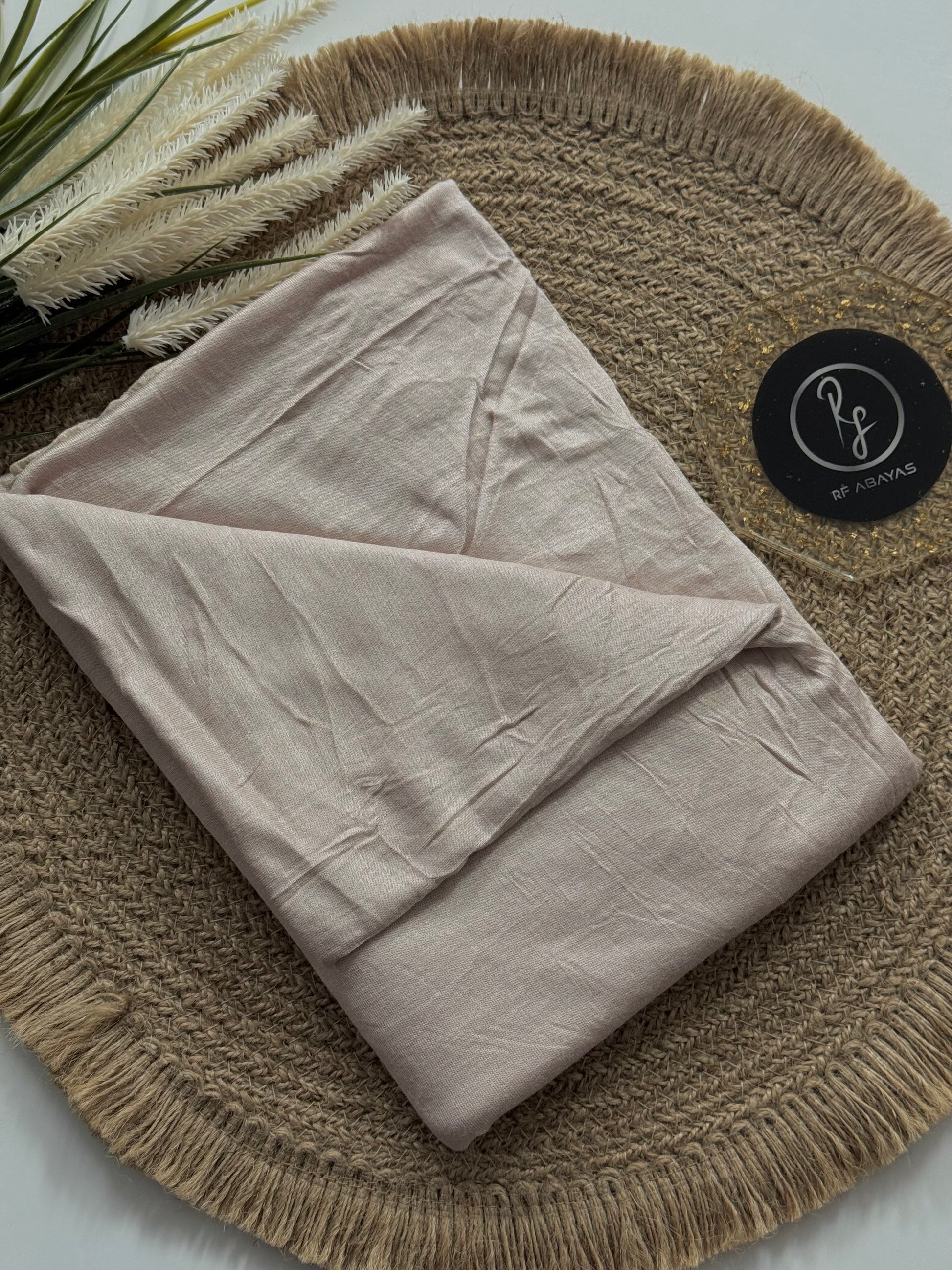 Ivory bamboo jersey hijab by RF Abayas, lightweight and soft fabric, styled in a flowing drape.